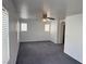 An open bedroom featuring a ceiling fan and multiple windows at 5661 Bonds Flat St, Las Vegas, NV 89148