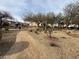 Scenic walking path through a well-kept community green space, promoting an active lifestyle at 5661 Bonds Flat St, Las Vegas, NV 89148