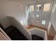 Open, airy foyer with hardwood floor and many windows at 5661 Bonds Flat St, Las Vegas, NV 89148