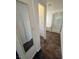 Hallway shot reveals access to a fully equipped bathroom with walk-in shower and tub at 5661 Bonds Flat St, Las Vegas, NV 89148