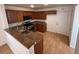 Kitchen featuring dark wood cabinets, granite countertops, and stainless steel appliances at 5661 Bonds Flat St, Las Vegas, NV 89148