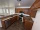 Kitchen featuring granite countertops, stainless steel appliances, and dark wood cabinetry at 5661 Bonds Flat St, Las Vegas, NV 89148