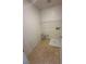 A laundry room with tile floors and washer hookups at 5661 Bonds Flat St, Las Vegas, NV 89148