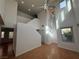 Bright living room features soaring ceilings, large windows and beautiful laminate floors at 5661 Bonds Flat St, Las Vegas, NV 89148