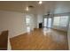 Bright living room with hardwood floors, fireplace, and sliding glass doors to the patio at 5661 Bonds Flat St, Las Vegas, NV 89148