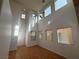 Open floor plan with lots of natural light and laminate floors, showcasing the spacious living room at 5661 Bonds Flat St, Las Vegas, NV 89148