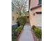 Charming home entrance with inviting walkway, surrounded by manicured bushes and landscaping at 5661 Bonds Flat St, Las Vegas, NV 89148