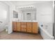 Primary bathroom features a dual sink vanity, soaking tub, and separate toilet at 5912 Cuddles Ct, North Las Vegas, NV 89081