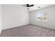 Comfortable bedroom with carpet flooring, a ceiling fan, and a window with blinds at 5912 Cuddles Ct, North Las Vegas, NV 89081