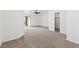 Large bedroom with neutral carpet, ceiling fan, and access to closet and backyard at 5912 Cuddles Ct, North Las Vegas, NV 89081