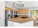 Kitchen island offers breakfast bar seating and is equipped with a sink at 5912 Cuddles Ct, North Las Vegas, NV 89081