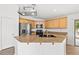 Open kitchen with center island, granite countertops, and stainless steel appliances at 5912 Cuddles Ct, North Las Vegas, NV 89081