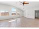 Spacious living area with tile flooring, high ceilings, and natural light at 5912 Cuddles Ct, North Las Vegas, NV 89081