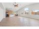 Bright open living and dining area with tile floors and view to the kitchen at 5912 Cuddles Ct, North Las Vegas, NV 89081