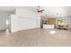 Bright living room features high ceilings, tile floors, and an open layout to kitchen at 5912 Cuddles Ct, North Las Vegas, NV 89081