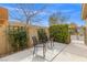 Private outdoor patio featuring climbing vines and wrought iron gate at 5912 Cuddles Ct, North Las Vegas, NV 89081