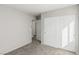 Neutral bedroom featuring sliding closet doors and access to another room at 6382 Lonesome Lake St, Las Vegas, NV 89148