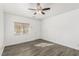 Bright bedroom with modern flooring and a ceiling fan at 6382 Lonesome Lake St, Las Vegas, NV 89148