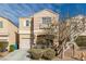 Two-story home with desert landscaping, two car garage, and neutral color palette at 6382 Lonesome Lake St, Las Vegas, NV 89148