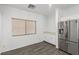 Breakfast nook area with natural light, built-in cabinets, and stainless fridge at 6382 Lonesome Lake St, Las Vegas, NV 89148