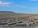 Aerial view of a residential community featuring desert landscaping and mountain views at 6447 Wide Sky St, Las Vegas, NV 89166