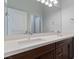 Bathroom with a double sink vanity, undermount sinks, and quartz countertop at 6447 Wide Sky St, Las Vegas, NV 89166