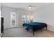 Bright bedroom with balcony access, natural light, and ceiling fan at 6447 Wide Sky St, Las Vegas, NV 89166