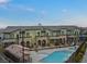 Exterior view of townhomes with a community pool at 6447 Wide Sky St, Las Vegas, NV 89166