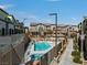 Exterior view of townhomes with a community pool at 6447 Wide Sky St, Las Vegas, NV 89166