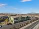 View of townhomes with garages and ample parking spots at 6447 Wide Sky St, Las Vegas, NV 89166
