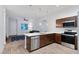 Modern kitchen features stainless steel appliances, a breakfast bar, and pendant lighting at 6447 Wide Sky St, Las Vegas, NV 89166