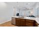Modern kitchen with an island, stainless steel appliances, and open layout to the living room at 6447 Wide Sky St, Las Vegas, NV 89166