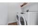 Convenient laundry room with modern, white washer and dryer at 6447 Wide Sky St, Las Vegas, NV 89166