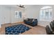 Cozy living room showcases wood floors, and an oversized window at 6447 Wide Sky St, Las Vegas, NV 89166