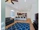 Open concept living room with modern decor, wood floors, and a view of the kitchen area at 6447 Wide Sky St, Las Vegas, NV 89166