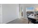 Bright office featuring neutral walls, carpet, balcony access and a modern desk at 6447 Wide Sky St, Las Vegas, NV 89166