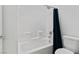 Bathroom features a tiled shower with a large showerhead, shower caddy, and glass door at 6447 Wide Sky St, Las Vegas, NV 89166