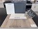 Interior design options with gray cabinets, white quartz counters, luxury vinyl plank flooring, and stainless faucet at 6616 Tumoulin St, Las Vegas, NV 89148