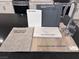 Interior design options with gray cabinets, white quartz counters, neutral carpet, and luxury vinyl plank flooring at 6616 Tumoulin St, Las Vegas, NV 89148
