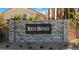 Elegant stone sign displaying the community's name, 'Red Bend', set in a lush landscape at 6616 Tumoulin St, Las Vegas, NV 89148