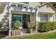 Cozy patio with pergola, sliding glass door, and manicured hedges for added privacy at 6923 Emerald Springs Ln, Las Vegas, NV 89113