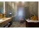 Contemporary bathroom with a dual shower, stone accents, and stylish vanity at 6923 Emerald Springs Ln, Las Vegas, NV 89113