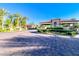 Beautiful community entrance, with gorgeous landscaping and brick paved driveway at 6923 Emerald Springs Ln, Las Vegas, NV 89113