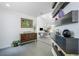 Open entryway with gray tile, display shelves, modern decor, and painting at 6923 Emerald Springs Ln, Las Vegas, NV 89113