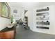 Open entryway with gray tile, display shelves, modern decor, and painting at 6923 Emerald Springs Ln, Las Vegas, NV 89113