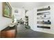 Inviting foyer with decorative shelves, artwork, and a view into the living spaces at 6923 Emerald Springs Ln, Las Vegas, NV 89113