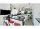 Modern kitchen with stainless steel appliances, a breakfast bar, and an open layout at 6923 Emerald Springs Ln, Las Vegas, NV 89113