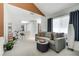 Comfortable living area with sleek furniture, exercise equipment, and large window providing natural light at 6923 Emerald Springs Ln, Las Vegas, NV 89113