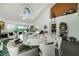 Bright, open living area with high ceilings, stylish decor, and large windows at 6923 Emerald Springs Ln, Las Vegas, NV 89113
