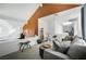 Stylish loft featuring a seating area, exercise equipment, and a bright accent wall at 6923 Emerald Springs Ln, Las Vegas, NV 89113